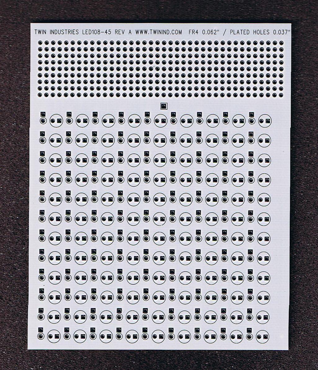 Twin Industries-LED108-45 null LED Protoboard with 108 LED mounting locations. Bus bars, prototyping holes, white soldermask. FR4 Material. Dim = 4.0" x 5.0"